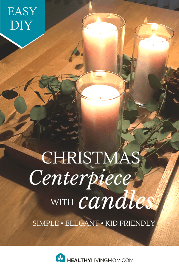 How to Make a Christmas Centerpiece With Candles That's Kid Friendly But Elegant 2 I love to bring in some joy and warmth to our home by having a Christmas centerpiece with candles on our table throughout the season. And when I say season—it can stay out all winter. It’s not too Christmas-y. It’s super fun to see people post their Christmas tours or Winter tours of their homes—but honestly, it’s not all that realistic for young families. So for us, we just try to keep things simple and family friendly. This year, I used pretty much everything that we already had on hand to create this simple Christmas centerpiece with candles. It literally only cost me $6. (picture) My husband and I especially struggle with feeling seasonal depression most during this winter—so I’ve had to learn some ways to help us fight off those winter blues. And this is one way that I’ve found to really help. I look for ways to combine fresh greenery and candles. The best part about the greenery I used this year? It’s already cut and it dries really nicely. In fact, I’ve found a new love for working with fresh eucalyptus the past year. For the candles, I’ve used real ones, but they are are friendly and safe for kids. I've either put them in large glass containers or candle holders that are closed. Another option is to use battery powered candles—but that’s just not the same. I love real candles. I’ve realized that just adding this simple Christmas centerpiece with candles to our home, it makes such a big difference. It’s especially noticeable for us emotionally around the month of February—when winter seems to be dragging on for forever. Here’s my list of materials that I used this year—all of which we already owned. 1 Wood serving tray 3 Glass hurricane candle vases 2 Medium size white pillar candles 1 Large size white pillar candle 2 Large pine cones 1 fresh bunch of eucalyptus The wood serving tray was my husband’s grandmothers tray. This piece is the key to making this winter centerpiece family friendly and functional. What I love about it, is that it makes the centerpiece movable. Like you can move it to the side of the table if you need to use the table for something else. Or you can easily remove it from your table completely—for a short amount of time—then put it back. The glass hurricane candle vases are actually from our wedding—along with the pillar candles as well. (picture of us behind candles) Our son broke one of the vases a year ago—totally my fault—I had the vases in the wrong spot! Anyways, I needed to find a replacement medium size glass vase and I didn’t want to pay $7 or $8 for it. So the best place to find these is at Dollar Tree for $1. You can find both the large and medium size. For the pillar candles, I originally purchased these at Michaels Craft Store. If you go on their web site you can get a 25% off coupon and use it to get these candles. The large pine cones I actually bought at a second hand shop in our town for $1 each. I only wanted 2 so that worked for me. You can find bags of large pine cones this time of year—spiced or plain—just about anywhere. However, I found that the cheapest plain pinecones were at Wal-mart for about $2. These are slightly smaller than what I bought, but they’re a good option. They also have some that are glittered! The fresh bunch of eucalyptus, I picked up at Trader Joes for $2.99. You can find eucalyptus this time of year fairly easily. They also have some faux bunches at craft stores for $2-$3. I fell in love with fresh eucalyptus a year ago when we celebrated my parents 50th Anniversary. My mom had asked for us to do a table runner of greenery and so I special ordered eucalyptus to pull it together. It smelled amazing and it was so elegant and beautiful. I think I’ll have to highlight a special how to DIY for more eucalyptus things in the future. The best part about this simple diy Christmas centerpiece with candles, is that it can be put together really simply, is portable, and yes, you can still have your son sit at the table and it won’t get in the way. Like I mentioned before, it truly is an elegant winter centerpiece that brings in something special for those winter months and it doesn’t look overly “Christmas-y”—like you forgot to put away your Christmas decorations.